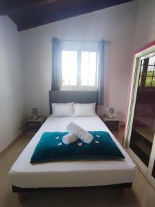 En eller flere senge i et værelse på Appartement avec vue mer à Capesterre-Belle-Eau