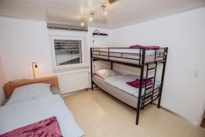 En eller flere senge i et værelse på Casa Hürtgenwald 4 Z für 5Personen