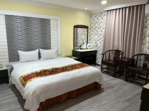 Ένα ή περισσότερα κρεβάτια σε δωμάτιο στο TC Hotel