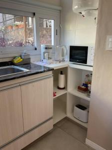 Kuchyň nebo kuchyňský kout v ubytování Los Zorzales + 21 fotografií