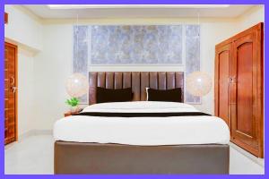 En eller flere senge i et værelse på Hotel Senvia Premium Stay