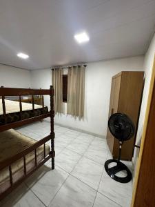 En eller flere senge i et værelse på Cantinho no Vale