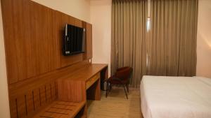 TV a/nebo společenská místnost v ubytování Hotel M7 Plaza