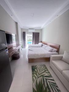 En eller flere senge i et værelse på Florenza Khamsin Resort