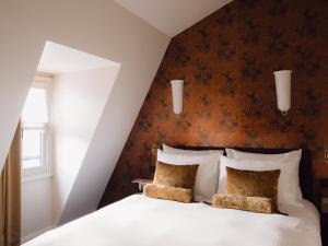 Postel nebo postele na pokoji v ubytování L'Opale Noire