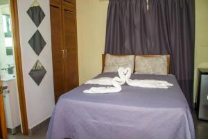 Postel nebo postele na pokoji v ubytování City Sea Exclusive Colonial Gem with Ocean View