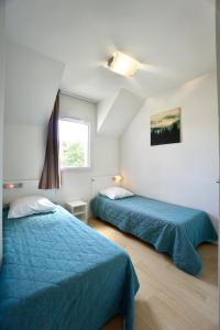 En eller flere senge i et værelse på Cabane aux étoiles -piscine-golf à 50m