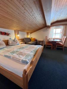 a bedroom with a large bed in a room at Badmeisterhof in Leogang