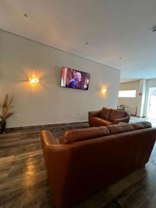 TV a/nebo společenská místnost v ubytování Hotel Internacional Guarulhos