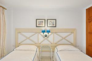 Giường trong phòng chung tại Playa Delphin 304