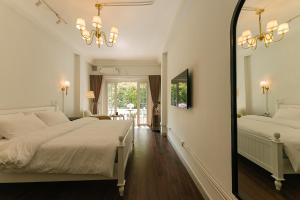 En eller flere senge i et værelse på Phung Hung House Hanoi Trainstreet