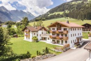 een luchtfoto van een huis in de bergen bij New Opening Penthouse Zirm in Selva dei Molini