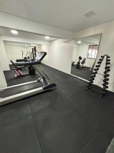 a gym with two treadmills and a treadmill at Grande Hotel Guarapuava in Guarapuava