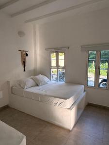 Ένα ή περισσότερα κρεβάτια σε δωμάτιο στο Cabaña Doradal MILOS