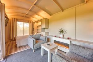 a living room with a couch and a chair at Host & Stay - Molly Mod in Aylsham +15 photos