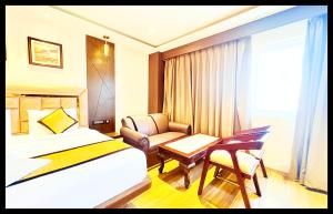 En eller flere senge i et værelse på The In Dra