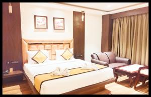 En eller flere senge i et værelse på The In Dra