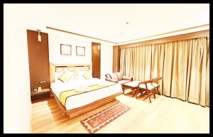 En eller flere senge i et værelse på The In Dra + 1 billede