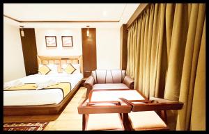 En eller flere senge i et værelse på The In Dra