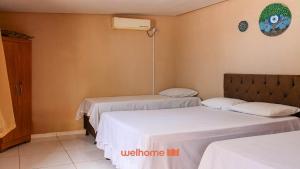 En eller flere senge i et værelse på Suite em Rio Grande com Vista Para a Montanha