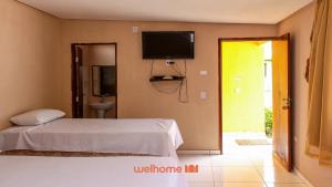 En eller flere senge i et værelse på Suite em Rio Grande com Vista Para a Montanha + 3 billeder