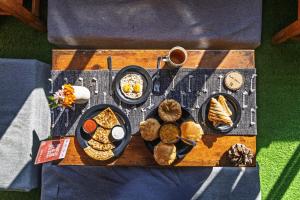a tray with different types of food on a table at PACK Mukteshwar in Mukteshwar +64 photos