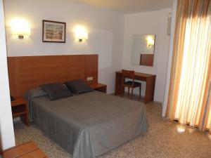 Postel nebo postele na pokoji v ubytování Hotel Jardín