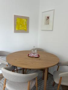a wooden table in a room with chairs at Modern apartment in Ferlach in Ferlach