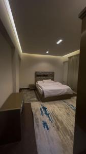 En eller flere senge i et værelse på الشيخ زايد شارع عمار ابن ياسر