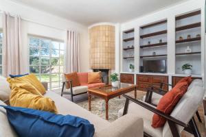 a living room with a couch and a table at Spacious Villa Swimming Pool by HostWise in Lagoa