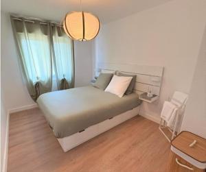 Postel nebo postele na pokoji v ubytování MODERN' FAMILY - VUE PILAT - Cosy Neuf & Confort - Parking et Clim GRATUIT - OFFRE SPECIALE PRO - Loc Home City services