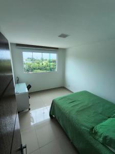 En eller flere senge i et værelse på Casa espaçosa em Meaipe