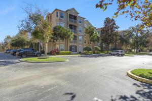 a parking lot in front of a building at 3BR Windsor Hills Condo Water Park and Skeeball Near Disney No Resort Fees in Orlando