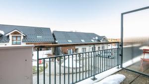 a balcony with a view of some houses at Les Balcons d Aix N701 2P6 in Les Déserts +4 photos