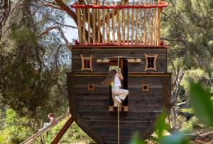 a girl is climbing on a play structure at Grand-Hôtel du Cap-Ferrat, A Four Seasons Hotel in Saint-Jean-Cap-Ferrat