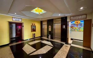 a lobby of a building with a sign on the ceiling at Hot Plaza Camarones - Love Hotel - Solo Adultos in Mexico City