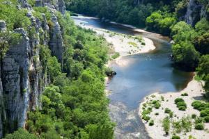 an aerial view of a river with trees and rocks at ZEcamping 3 étoiles pet friendly avec piscine et pataugeoire in Les Assions