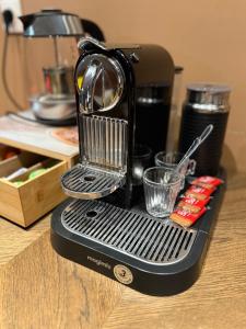 a coffee maker sitting on top of a counter at EASYHOME DUNKERQUE in Dunkerque
