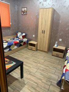 a room with two bunk beds and two cabinets at Квартири ЦЕНТРАЛ in Dolna Mitropoliya +51 photos