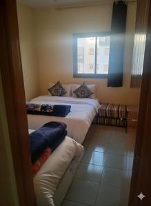 En eller flere senge i et værelse på lina appartement