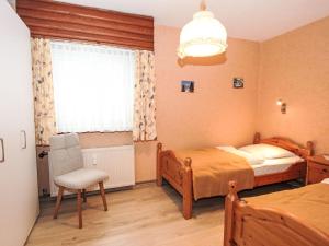 En eller flere senge i et værelse på Apartment Am Birkenhain-6 by Interhome