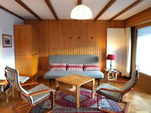 a living room with a couch and two chairs at Apartment Diamant 39 by Interhome in Villars-sur-Ollon