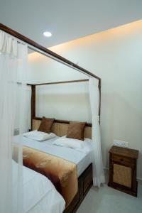 Giường trong phòng chung tại Le Penguin Serviced Apartments