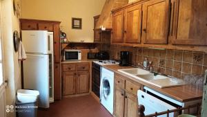 Kuchyň nebo kuchyňský kout v ubytování Domaine du Puy Bobet - Vue Unique & Charme 10 pers