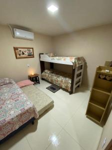 Postel nebo postele na pokoji v ubytování Recanto do Ofurô