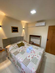 Postel nebo postele na pokoji v ubytování Recanto do Ofurô + 24 fotografií