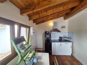a kitchen with a table and a counter top at La maruca loft 3000 in Santander +27 photos