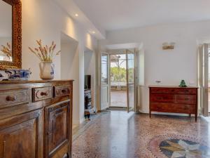 a room with a dresser and a vase on top of it at Apartment Villa Le Palme by Interhome in Rio Marina
