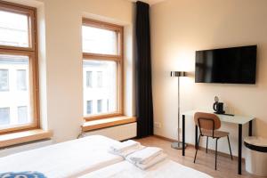 Giường trong phòng chung tại Hotel Finn