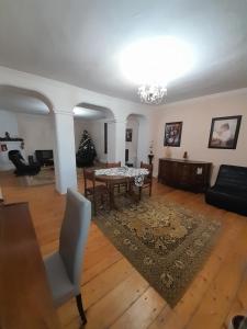 a living room with a table and a couch at Apartment Nana in Mtskheta